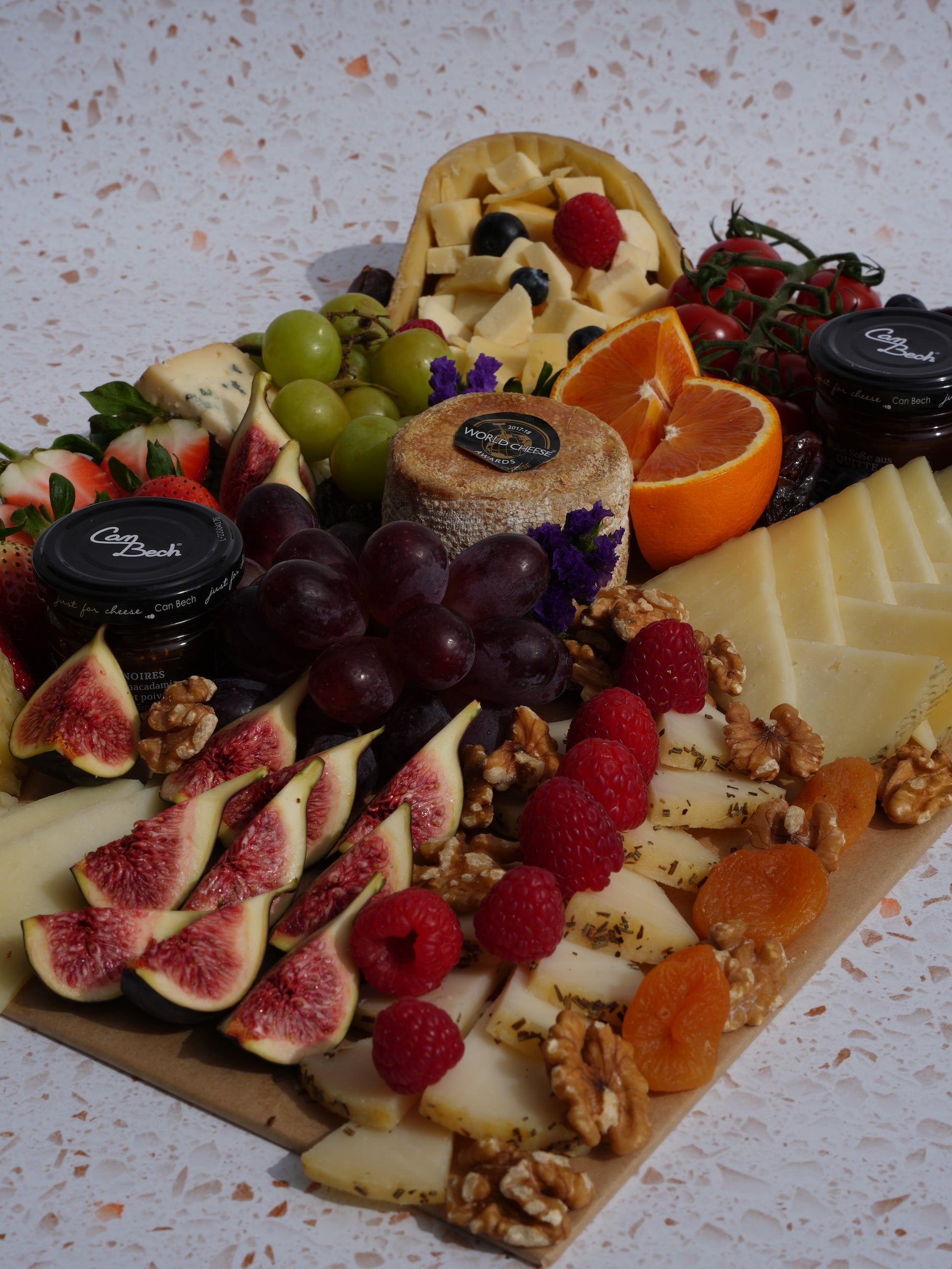 Grazing board with an amazing selection of Spanish Cheese, seasonal fruits, jams and nuts